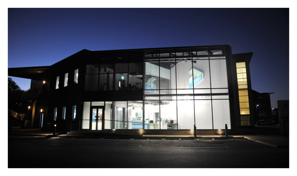 Night time image of the outside of Paragon hospital building